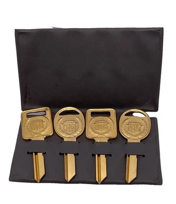 Set of 4 UN-CUT Gold Cadillac Keys In Sleeve 2 Each Ignition and Door/Trunk - Image 1 of 4