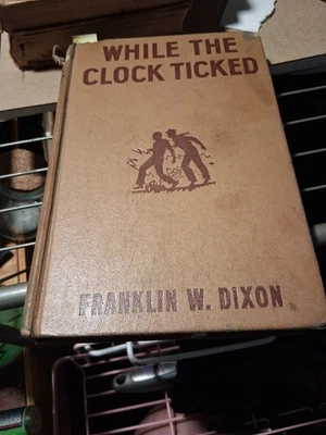 While the Clock Ticked – Franklin W. Dixon 1932 Grosset & DunlapFirst Edition - Image 1 of 4