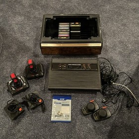 Atari 2600 Console With 16 Games, 4 Joysticks And 2 Paddles + Game Center