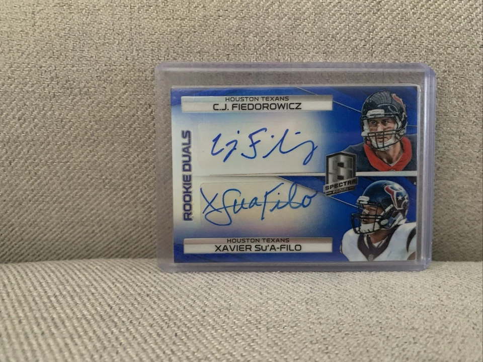 2014 Panini Spectra - Rookie Dual Autographs C.J. Fiedorowicz, Xavier Su'A-Filo  - Image 1 of 2