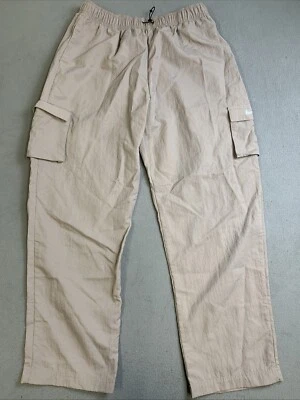 Pantalones cargo Nike tejidos para mujer talla mediana esenciales tiro alto patinador color rosa Foto 1 de 4