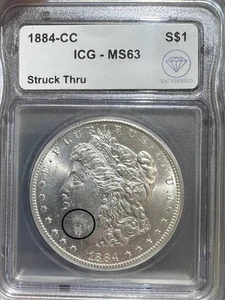 1884 CC Morgan Silver Dollar ICG MS-63 Struck Thru IDC Verified - Picture 1 of 2