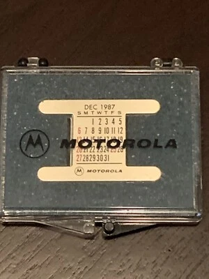 VINTAGE 1987 MOTOROLA WRIST CALENDAR METAL PLATE SET WITH ORIGINAL CASE SHAPER - Image 1 of 4
