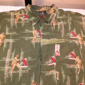 VINTAGE AKADEMIKS FIRST MISSION ARMY HAWAIIAN BOWING SHIRT Mens XL  - Imagen 1 de 6