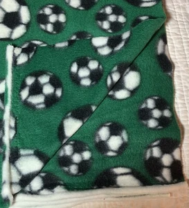 72" x 60" Soccer Balls Allover on Solid Green Sports Fleece Fabric Print - Picture 1 of 10