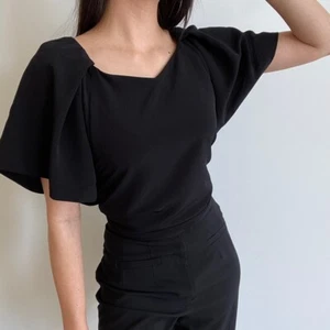 Blusa Copine Batwing negra talla S nueva con etiquetas - Imagen 1 de 6