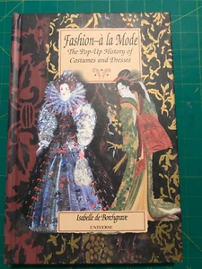 Mode a la Mode: Das Buch der Kostüme und Kleider mit Puppe von Issey... - Bild 1 von 9