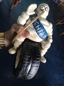 Vintage 9” 10 Lb Cast Iron Michelin Man Riding Inflating Tire Posable Arm - Picture 1 of 10