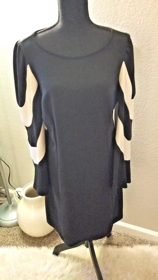 Vestido firma sangría, blanco y negro. Manga larga. Talla 10. Foto 1 de 4