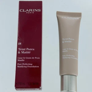 Clarins Teint Poren und Matit Foundation 04 Nude Amber 1,0 Oz. - Neu Box beschädigt - Bild 1 von 2