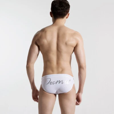 Traje de baño calzoncillos tiro bajo secado rápido color liso playa surf traje de baño para hombre Foto 1 de 4