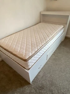 White twin size bed with headboard, bookshelf, and three wide storage drawers. - Picture 1 of 5