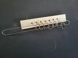 Rompecabezas de alambre de anillos chinos antiguos de 13 pulgadas de largo con 7 anillos - Imagen 1 de 4