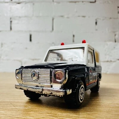 Carro modelo Mercedes-Benz G Wagon Class Police azul Realtoy fundido 1:64 - Imagem 1 de 4