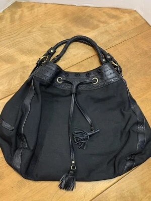 Bolso de mano Cole Haan negro de nailon y cuero con asas trenzadas, tapa ceñida con borla Foto 1 de 4