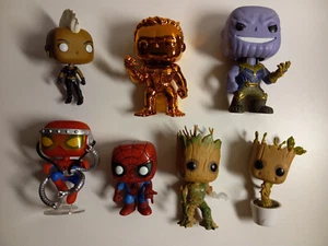 7 Marvel Funko Pops: 2 Spiderman - 2 Grut - Storm - Iron Man - Thanos - Picture 1 of 3