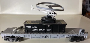 30-7658..MTH..Flat Car w/ Flying Helicopter - Picture 1 of 3