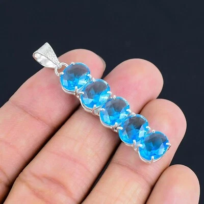 Colgante de plata de ley 925 con piedras preciosas de topacio azul suizo hecho a mano Foto 1 de 4