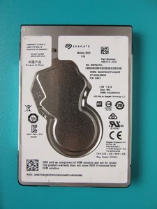 Seagate ST1000LM035 1RK172-570 1TB 7mm 2.5" HDD Jan 2020 China WU EB01 WKP - Picture 1 of 8