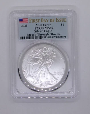 2023 MINT ERROR, A.S.E., PCGS MS69, FDOI, Struck Though Obverse at the "L" - Image 1 of 3