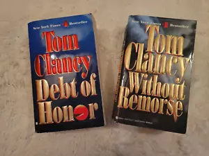 COLLECTION OF 2 TOM CLANCY PAPERBACK NOVELS - (WITHOUT REMORSE & DEBT OF HONOR) - Foto 1 di 7