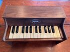 Vintage 1950s Jaymar woodgrain table top toy piano with 30 working keys 