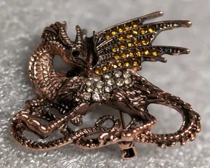 Spilla drago volante in cristallo tono rame - Foto 1 di 9
