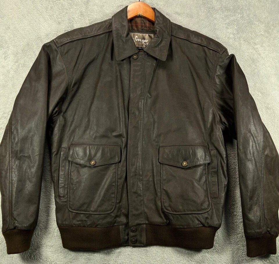 Chaqueta de bombardero Cougar para hombre alta vintage de cuero marrón aislada chaqueta XLT para hombre Foto 1 de 4