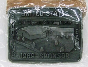 Hebilla de cinturón patrocinador equipo centro tiro olímpico de Estados Unidos 1989 vintage - nueva y sellada - Imagen 1 de 3