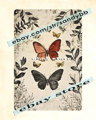 Letrero botánico mariposa metal alas negro/naranja boceto floral Foto 1 de 4