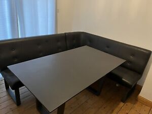 glass dining table with corner seating 