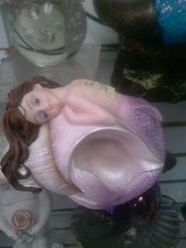 Pastel Mermaid Resting on Shell
