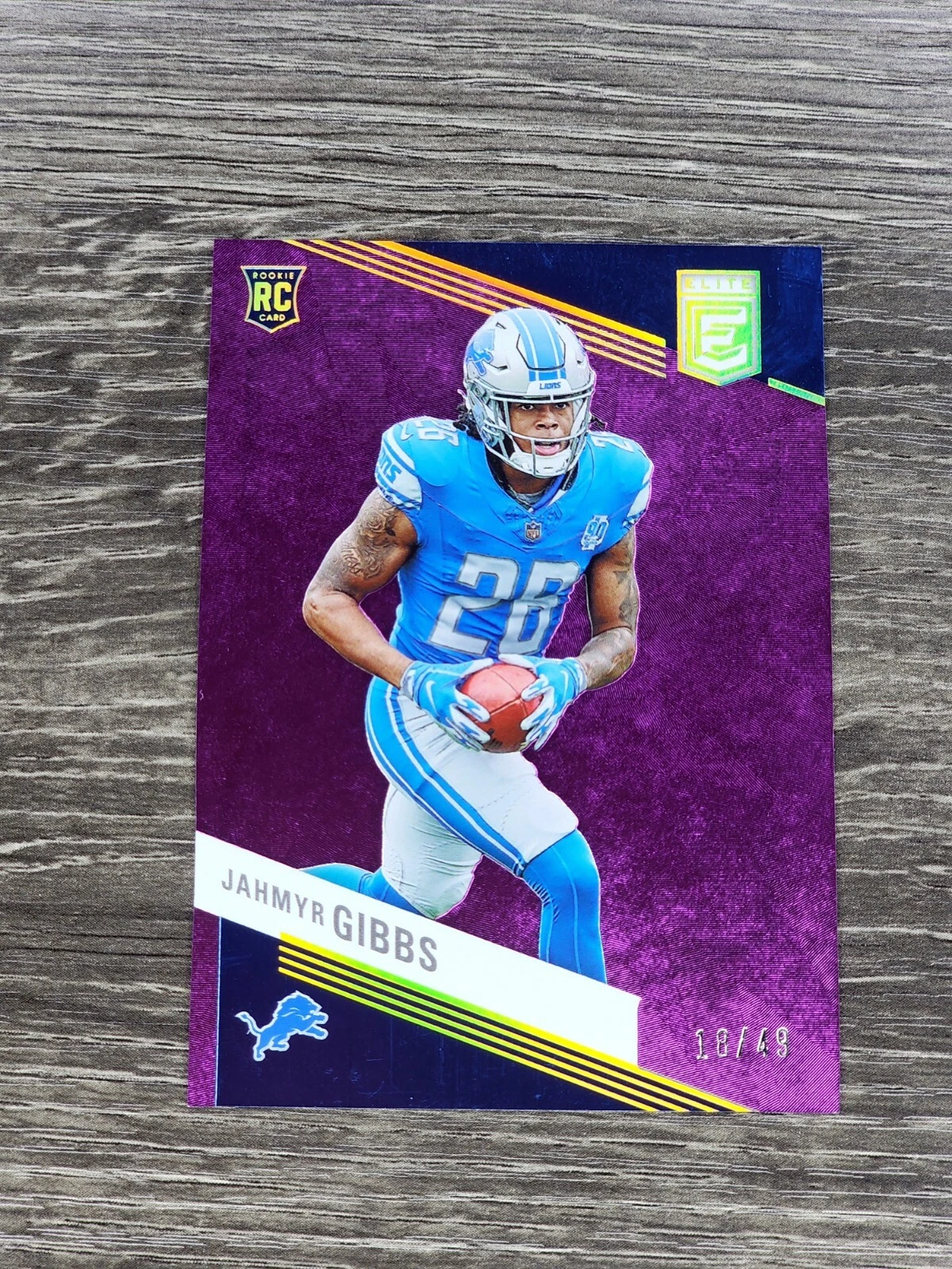 2023 Panini Donruss Elite Football Lions RC Jahmyr Gibbs Purple /49