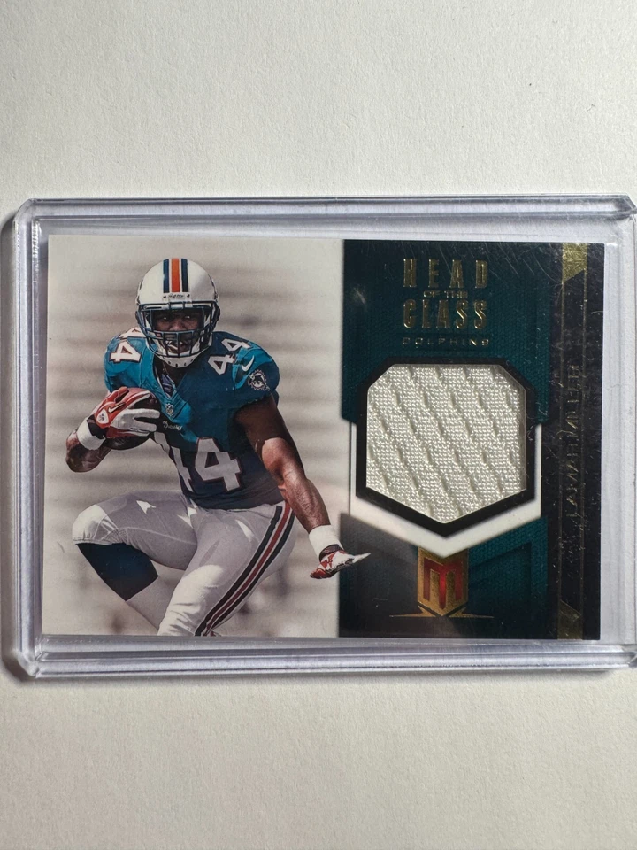 K291,297 - 2012 Momentum Head of the Class Materials #19 Lamar Miller #/249 - Image 1 of 1