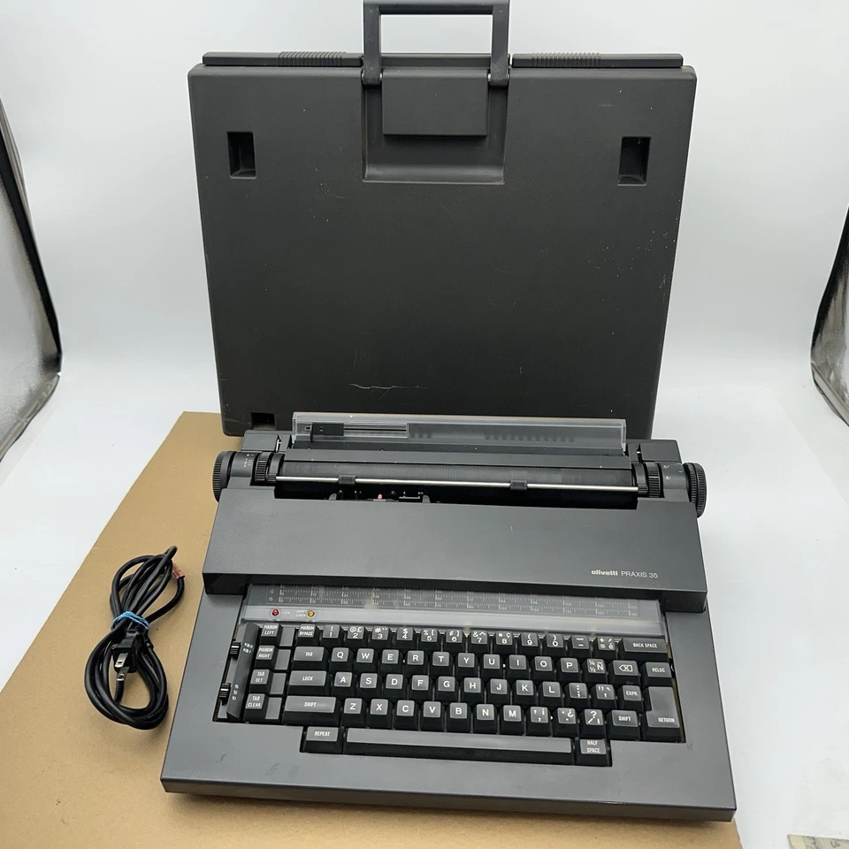 Máquina de escrever Olivetti PRAXIS 35 com estojo rígido de plástico década de 1980 liga precisa de serviço* - Imagem 1 de 4