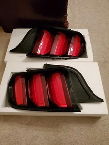 Mustang red tail lights, new, still in box - Picture 1 of 3