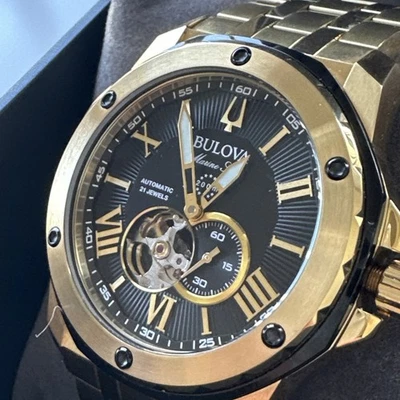 Reloj Bulova Marine Star Hombre Automático Esqueleto Tono Dorado 45MM 98A273 Foto 1 de 4
