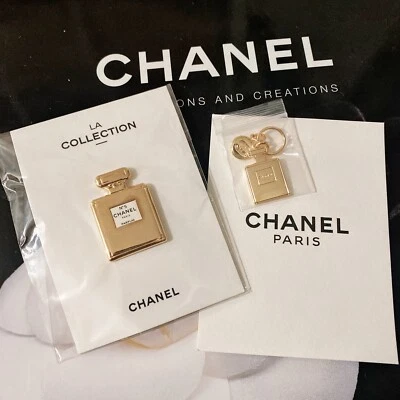 Chanel Oro Nº5 Botella de Perfume Dije + Broche Prendedor / Con Bolso de Cuerda Negro Foto 1 de 4