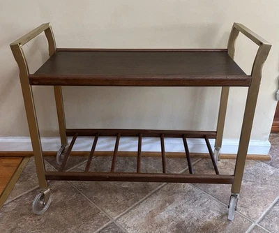 Carro de televisión rodante vintage de mediados de siglo ruedas de plástico metal madera Foto 1 de 4