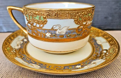 NIPPON TEACUP & SAUCER SET RAISED BEADED GOLD ENAMEL SWIMMING GEESE SWANS BIRDS - Image 1 of 4