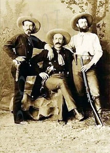 ANTIQUE REPRODUCTION 8X10 STUDIO PHOTOGRAPH 3 COWBOYS COLT PISTOLS SHOTGUN - Picture 1 of 1