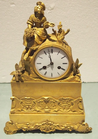 A FRENCH EMPIRE ORMOLU MANTLE CLOCK WITH A FIGURE OF BEAUTY & BOUQUET FLOWERS Cover