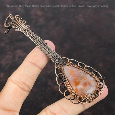 Oferta de Navidad Cobre Pera Piedra Solar Natural Envuelto Guitarra Colgante Joyería Foto 1 de 4