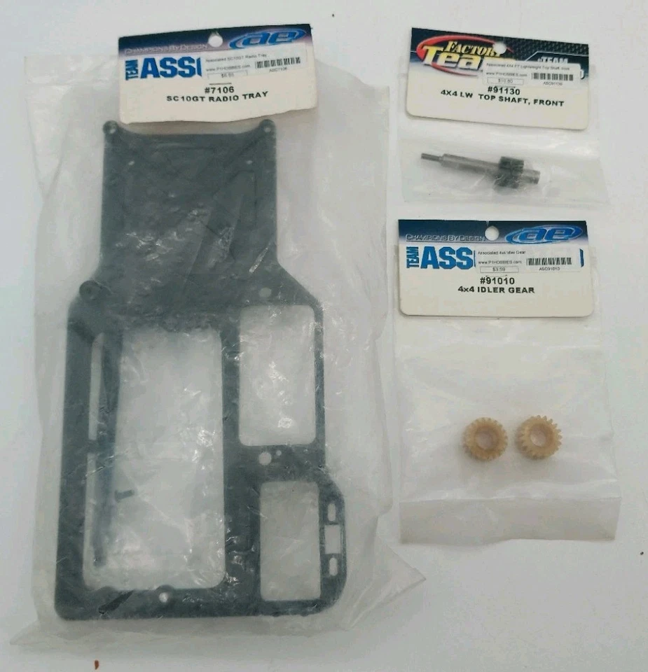 Team Associated Misc. RC Parts Lot SC10GT Radio Tray 4x4 LW Top Shaft Idler Gear - Image 1 of 1