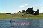 PHOTO  CLONMACNOISE CASTLE SEEN FROM A BOAT AT THE LANDING STAGE. THE DINGHY HAD
