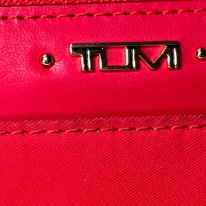 Tumi trifold red wallet with area for drivers license, cards and money. Read - Picture 1 of 11