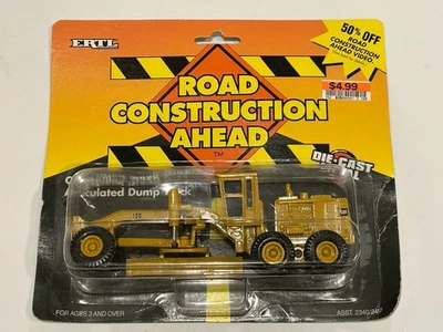 ERTL Road Construction Caterpillar 12G Motor Grader Diecast ERROR Wrong Package - Image 1 of 3