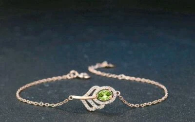 Oval Cut Green Peridot With Sparklign CZ Classic Leaf 14k Rose Gold Bracelets - Image 1 of 4