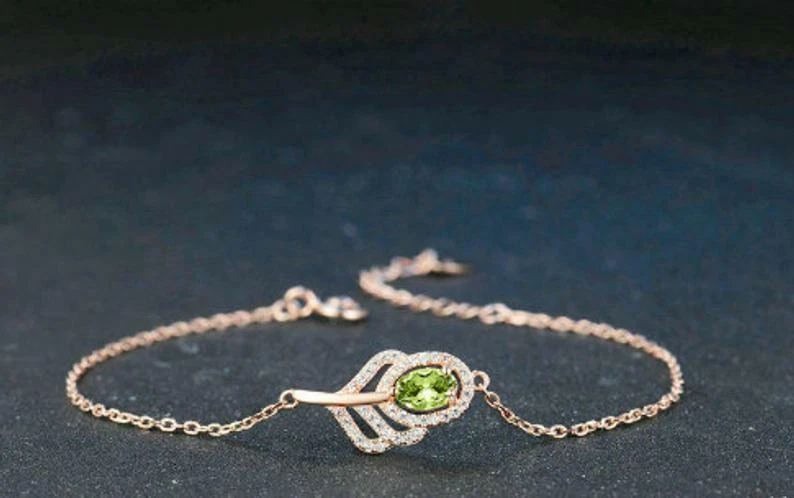 Oval Cut Green Peridot With Sparklign CZ Classic Leaf 14k Rose Gold Bracelets - Image 1 of 4