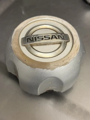 Tapa central rueda Nissan Frontier/Xterra 40315-1Z800 emblema cromado 1998-2004 Foto 1 de 4